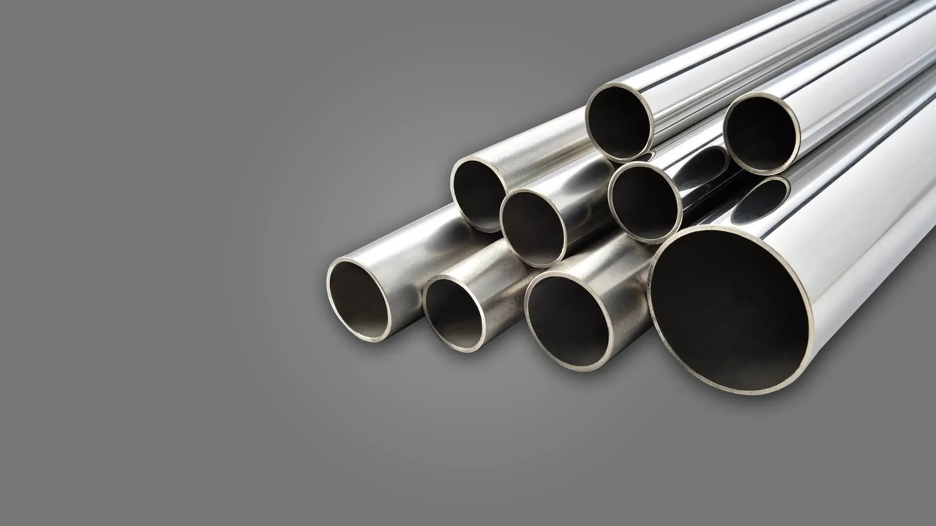 Seamless stainless steel straight tubes stacked in a rack